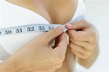 patient measuring breasts photo